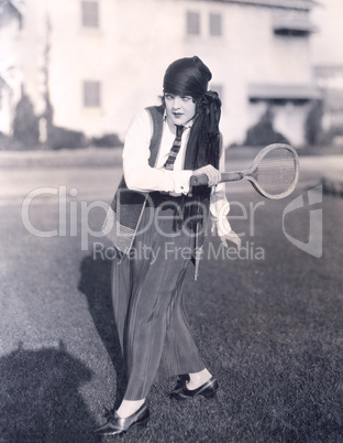 Woman playing badminton outdoors