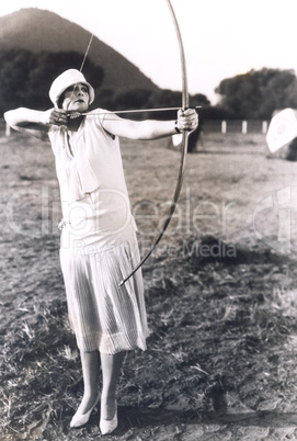 Woman practicing archery