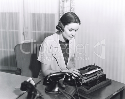 Woman typing a letter