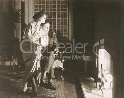 Couple sitting by the fireplace