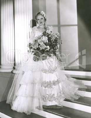 Portrait of beautiful bride holding bouquet