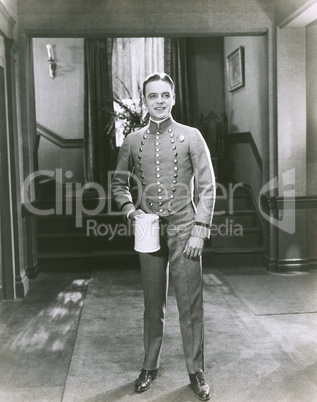 Bellboy holding pitcher