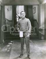 Bellboy holding pitcher