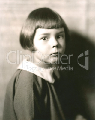 Portrait of cute little girl with bobbed hair