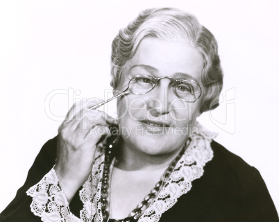 Woman holding lorgnette