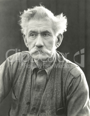Portrait of senior man with bushy moustache