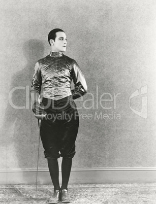 Swordsman posing with fencing foil