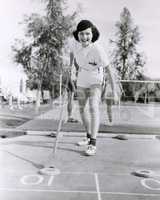 Woman enjoying a game of shuffleboard
