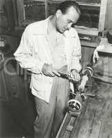 Carpenter at work in his woodshop