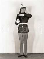 Full length portrait of marine standing at attention