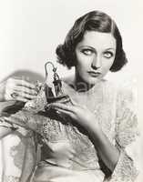 Woman holding perfume atomizer