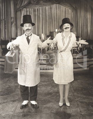 Performers with fake mustaches carrying briefcases