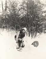 Woman putting on snowshoes
