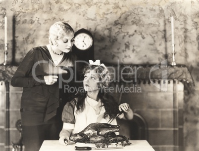 Woman getting advise on turkey carving