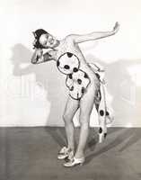 Dancer posing in polka dot apron
