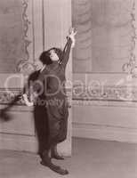 Woman standing in dramatic pose