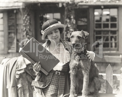 Woman posing with her wire hair terrier