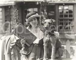 Woman posing with her wire hair terrier