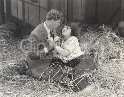 Couple fighting in barn