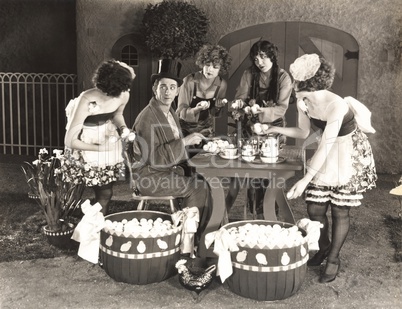 Young women offering an abundance of eggs to man