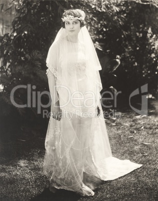 Bride posing in back yard