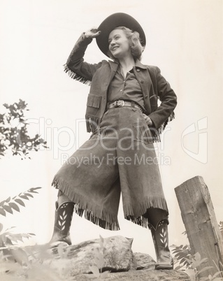 Cowgirl tipping her hat