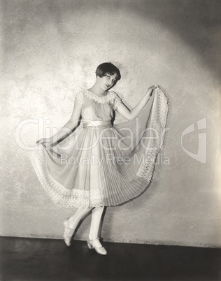 Woman modeling pleated dress