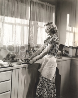 Woman making homemade orange juice