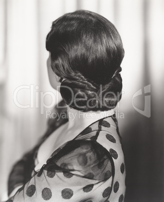 Rear view of woman's 1940s hairstyle