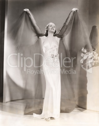 Woman in satin negligee with chiffon overlay