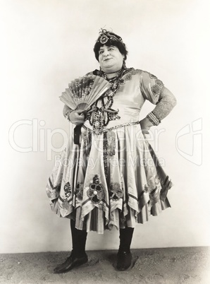 Man with fan dressed in women's clothing, 1920s