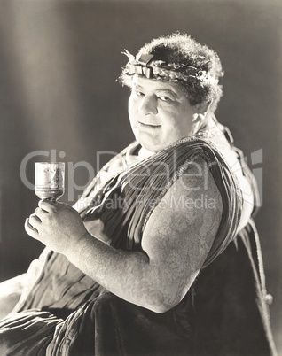 Tattooed man in ancient Greek costume