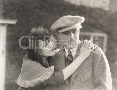 Woman comforting sad man