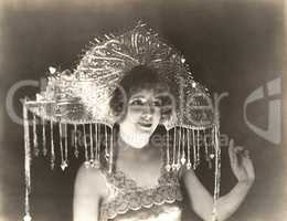 Woman wearing beaded headdress with tassels