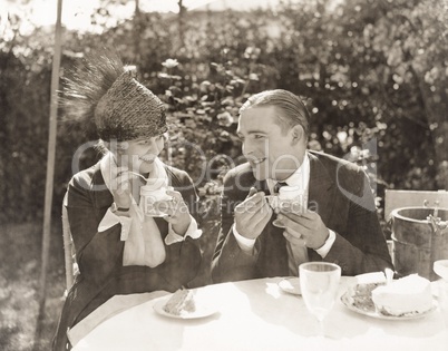 Couple eating ice cream and cake