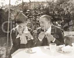 Couple eating ice cream and cake