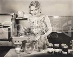 Woman making preserves