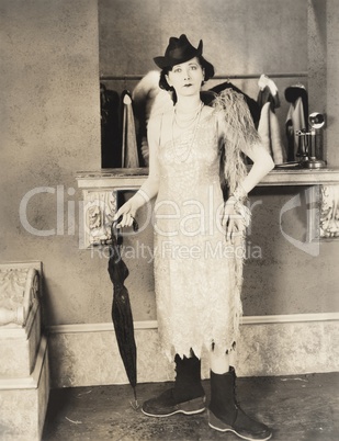 Woman prepared for a rainy evening on the town