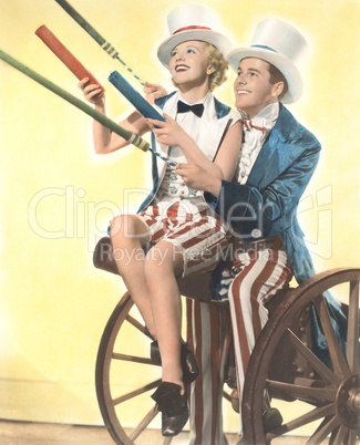 Two patriotic people with Roman candles celebrating July 4th