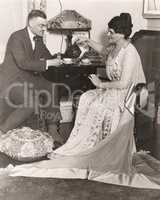 Man and woman enjoying tea time at home