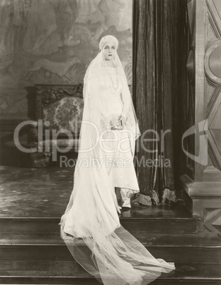 Bride posing on top of steps