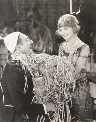 Man and woman covered in streamers