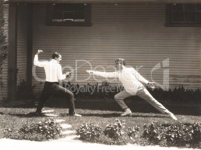 Two men fencing