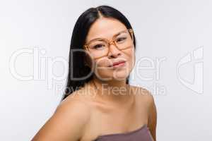 Beautiful Korean woman in glasses in studio