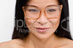 Beautiful Korean woman in glasses in studio