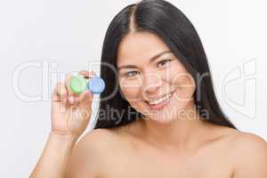 Woman with container for contact lenses