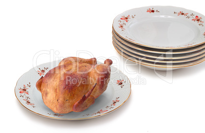 Delicious fried chicken on white ceramic dish