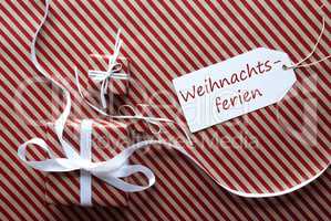 Two Gifts With Label, Weihnachtsferien Means Christmas Break