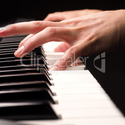 Playing piano close up