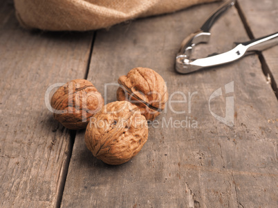 Three walnuts on a wooden table Three walnuts on a wooden table